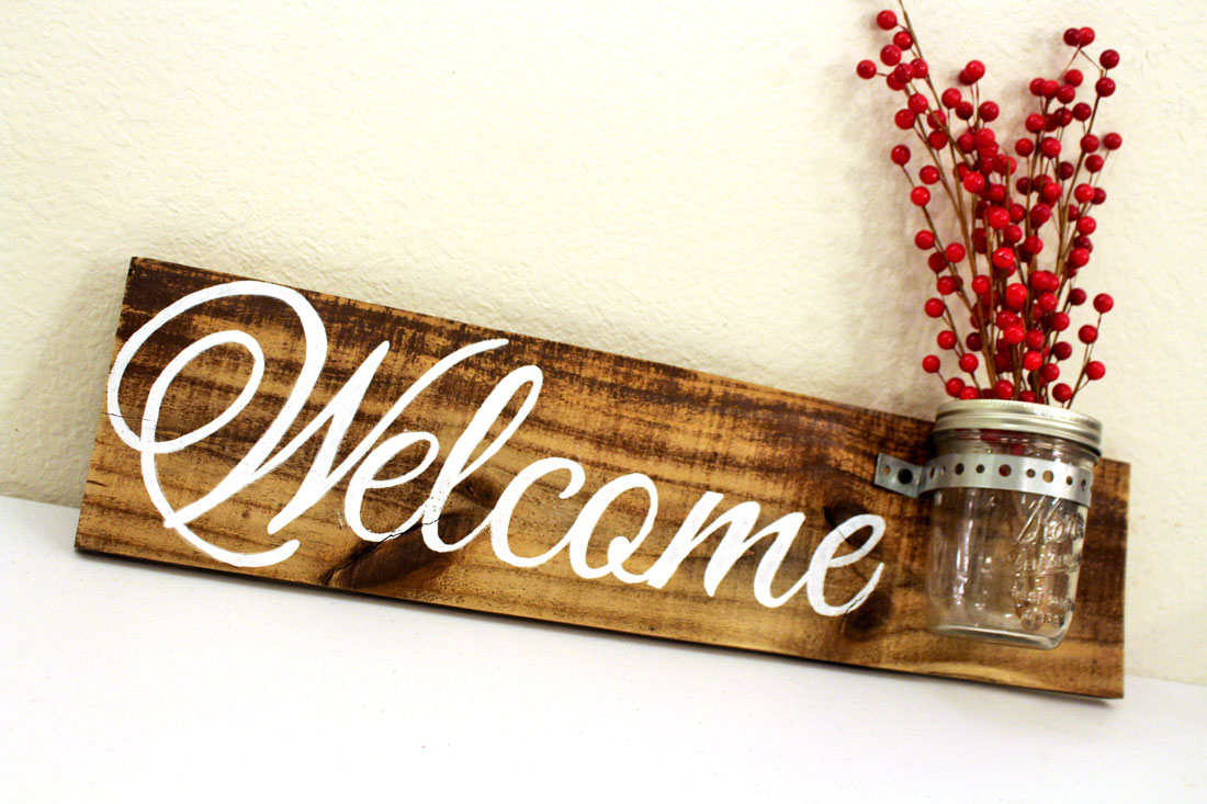 welcome angle left with red branches w mason jar